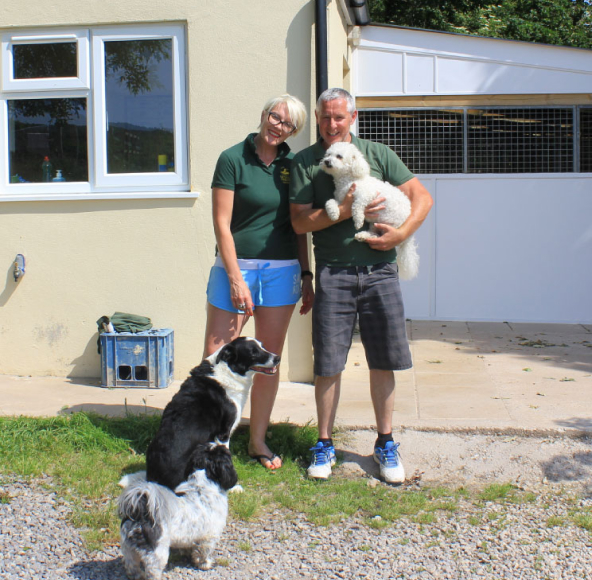 The kennel owners Alan and Allie with their dogs